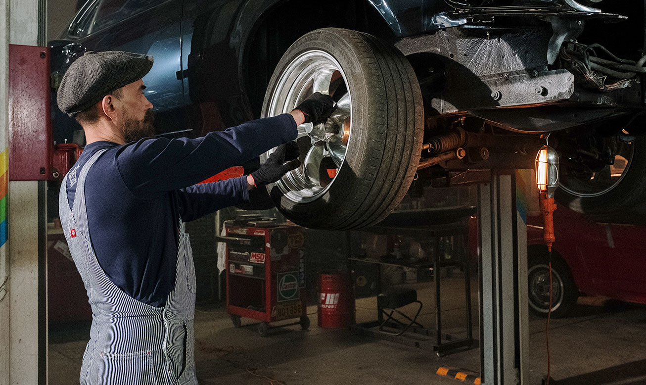 Mechanic Changing a Wheel Mechanic Changing a Wheel